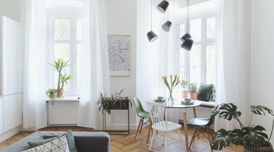 A breakfast room featuring white made-to-measure curtains