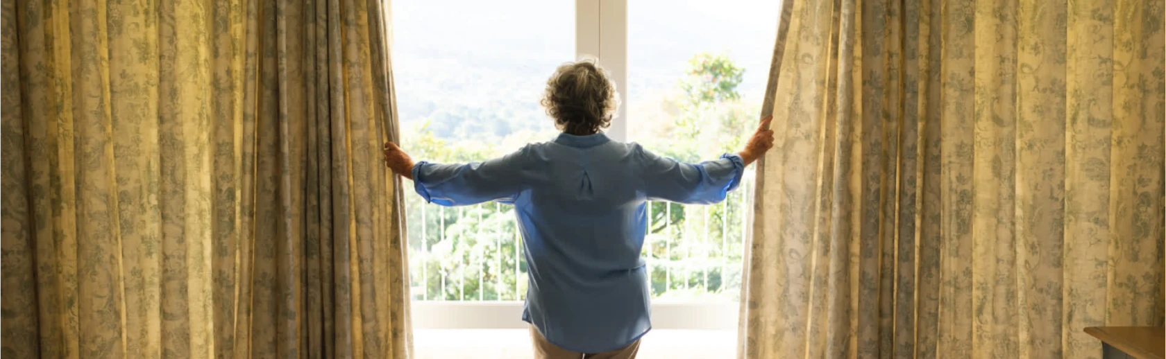 lady drawing curtains
